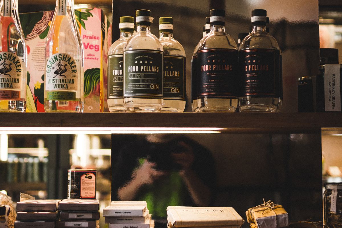 Well-stocked shelves of groceries and drinks in a convenience store